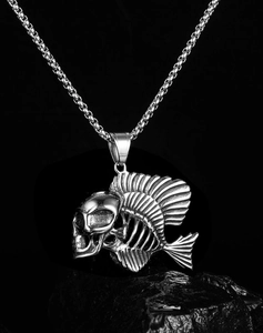 Detailed view of punk skeleton fish pendant in polished steel on black stone background