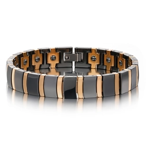 Detailed macro of black ceramic magnetic therapy bracelet with rose gold metal links