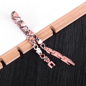 Women's rose gold magnetic therapy bracelet with cutout heart links and copper finish