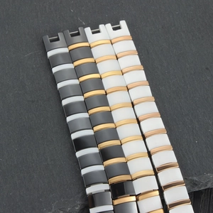 Detail of luxury ceramic and magnetic bracelet links with polished gold plating