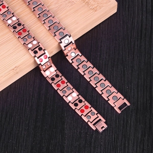 Detailed view of copper magnetic bracelet with embedded health elements and fold-over clasp