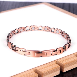 Copper magnetic health bracelet featuring heart links and therapeutic magnet inserts