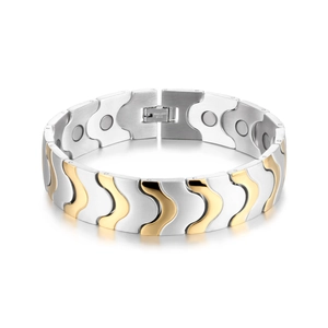 Detail of two-tone magnetic therapy bracelet with wave-shaped gold and silver links