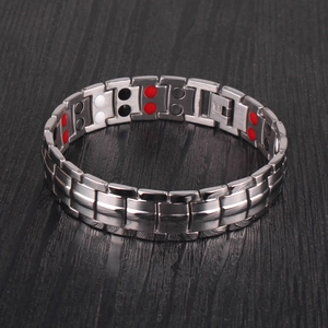 Detail view of silver stainless steel magnetic therapy bracelet with double-row energy stones