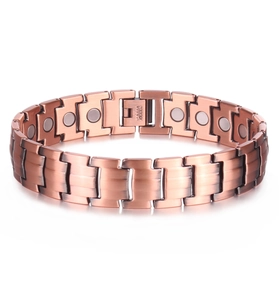 Men's copper magnetic bracelet with dual-row elements and brushed finish on white surface