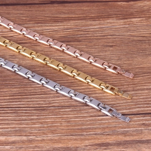 Detailed close-up of polished magnetic metal bracelets in silver, gold, and rose gold