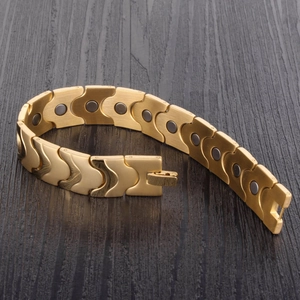 Men's wide gold magnetic therapy bracelet with brushed finish and inlaid stones