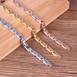 Detailed view of polished H-link chain bracelets in silver, gold, and rose gold finishes