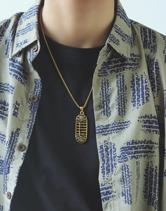 Golden abacus pendant necklace with traditional Fu character on vintage male model clothing
