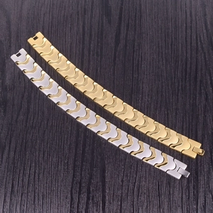 Men's wide magnetic energy bracelet with interlocking wave links in gold and silver