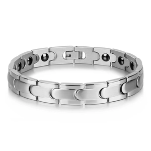Detail of stainless steel magnetic therapy bracelet for men with brushed link finish
