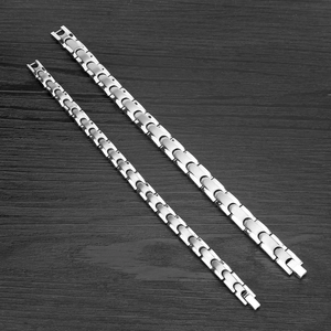 Silver magnetic couple bracelets in brushed stainless steel with a folding clasp