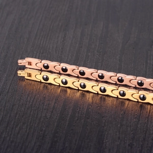 Twisted X-shaped crystal bracelets in gold and rose gold with black hematite stones