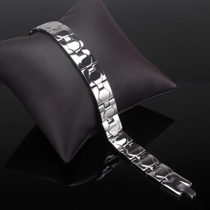 Polished silver magnetic therapy bracelet with classic H-shaped clasp on display
