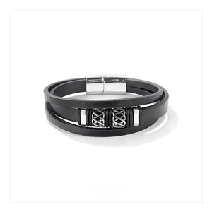 Detail of multi-layer black leather men's bracelet with textured silver magnetic clasp