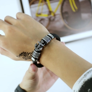Men's vintage anchor braided leather bracelet with silver metal charms and nautical style