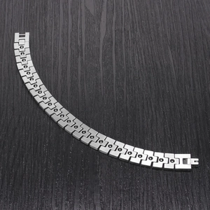 Detailed view of stainless steel bracelet links with black magnetic stone inserts