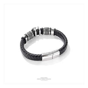 Detail of multi-layer braided leather bracelet with silver anchor magnetic clasp