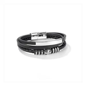 Detail of multi-layer black leather bracelet with silver metal plate and magnetic clasp