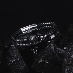 Macro shot of double-layer black woven leather bracelet with stainless magnetic clasp