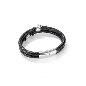 Detail of black multi-layer braided leather bracelet with silver skull charm and magnetic clasp