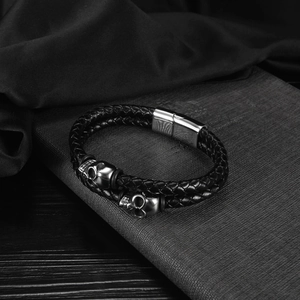 Men's multilayer braided leather bracelet with silver skull charms and magnetic clasp