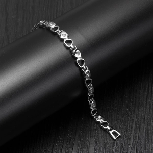 Silver-toned hollow heart bracelet with micro-paved crystals and jewelry fold-over clasp