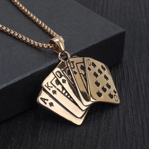 Macro view of gold royal flush poker pendant with black enamel spade details on box chain
