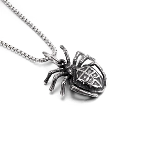 Detailed close-up of realistic spider pendant with textured abdomen on bead chain