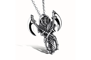 Macro detail of Gothic Grim Reaper pendant with crossed scythes in vintage steel