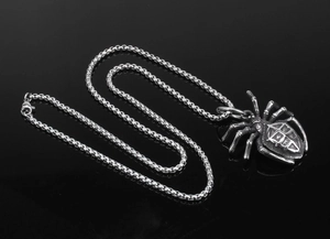 Gothic spider titanium steel pendant with metallic bead chain on reflective black background
