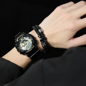 Men's dual-display black and gold sports watch paired with braided leather bracelets