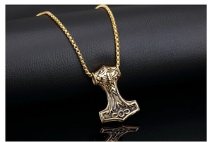 Macro shot of Viking Mjölnir pendant with intricate Norse mythology engravings
