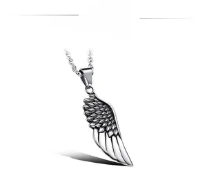 Detailed macro view of the silver angel wing pendant with intricate feather textures