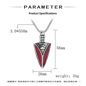 Detailed view of silver arrow pendant with red enamel, paw print, and dimensions