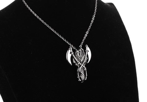 Detailed view of gothic stainless steel grim reaper pendant with cross scythes