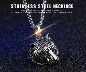 Detail shot of a tiger head pendant in polished stainless steel with wild textures