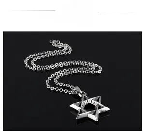 Macro shot of 3D intertwined Star of David pendant with detailed metal engravings