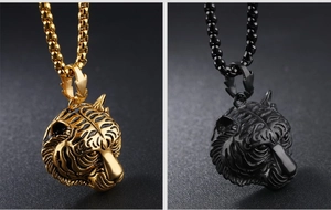 Detailed relief of tiger head pendants in gold and black with sturdy box chains