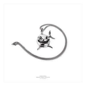 Detail shot of vintage stainless steel shark head pendant on a sturdy square box chain