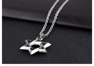 Close-up of titanium steel Hexagram pendant with sharp metal edges and classic cross chain