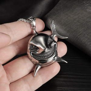 Detail of vintage stainless steel shark pendant with a grin on a sturdy bead chain