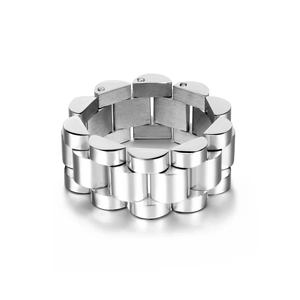 Close-up of silver metal ring featuring a solid watch link chain design with mirror finish