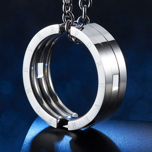 Macro shot of silver stainless steel necklace pendant with Forever engraving