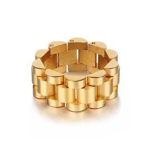 Close-up of gold watch link ring with polished and brushed stainless steel finish