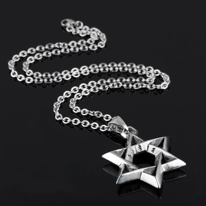 Vintage stainless steel Star of David pendant necklace with engraved details on black background