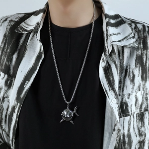 Close-up of a realistic silver shark pendant on a sturdy round chain necklace for men