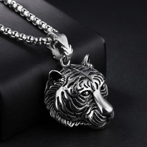 Vintage stainless steel tiger head pendant necklace with bold engraved details on black base