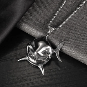 Polished silver stainless steel shark pendant necklace with an edgy laughing expression