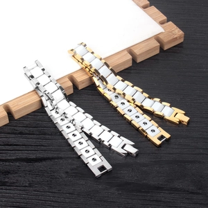 Bracelet de magnétothérapie avec incrustations céramique blanche et métal poli